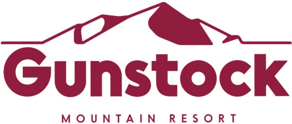 Gunstock Mountain Resort logo featuring the word “Gunstock” in bold maroon letters with a stylized mountain outline above and “Mountain Resort” below.