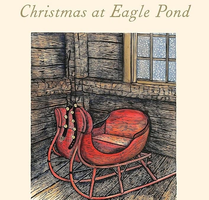 illustration of a red wooden sleigh inside a rustic room with wooden walls and a window, featured on the cover of christmas at eagle pond" by donald hall.