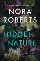 book cover of "hidden nature" by nora roberts, featuring bold text over a background of flowers and a spider web.