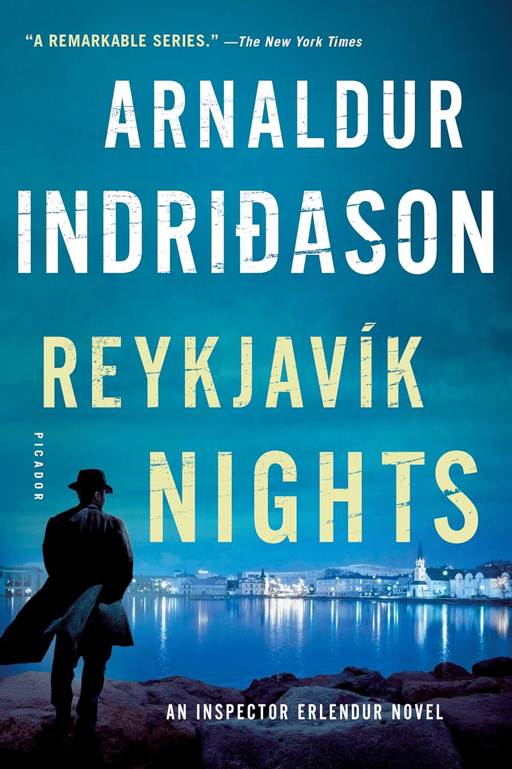 a silhouetted man in a hat stands by a body of water at night, with city lights in the background. text reads: arnaldur indridason reykjavík nights an inspector erlendur novel.