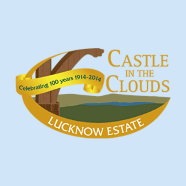 Logo for Castle in the Clouds, Lucknow Estate, featuring a wooden arch, landscape, and a ribbon stating 'Celebrating 100 years 1914-2014'.