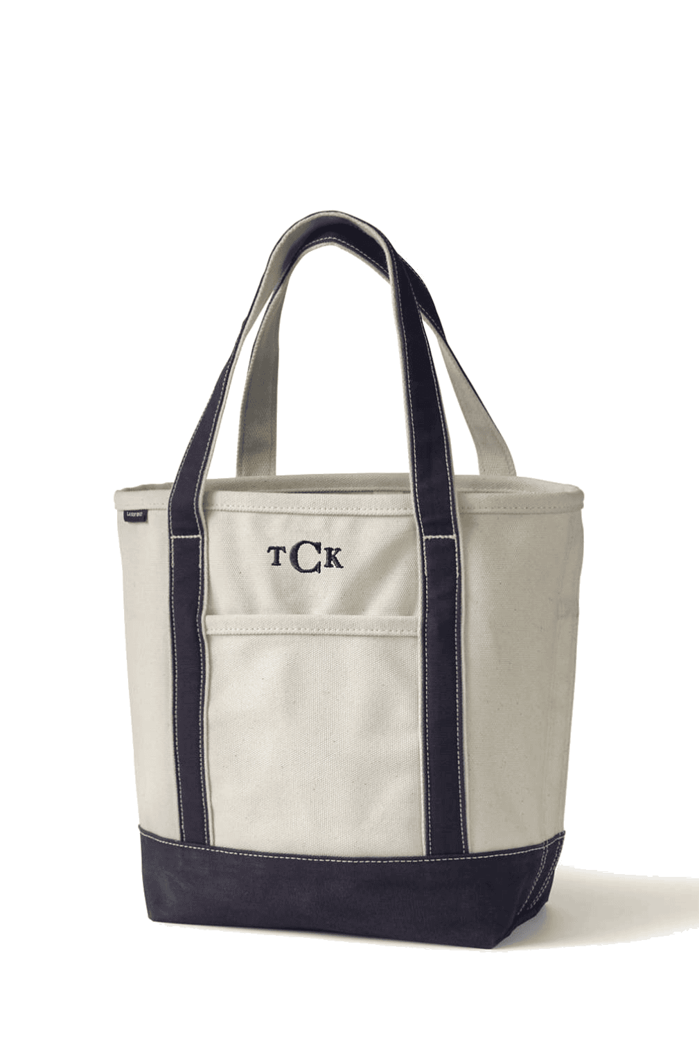 A canvas tote bag with black handles and trim, featuring the initials "TCK" embroidered on the front pocket.