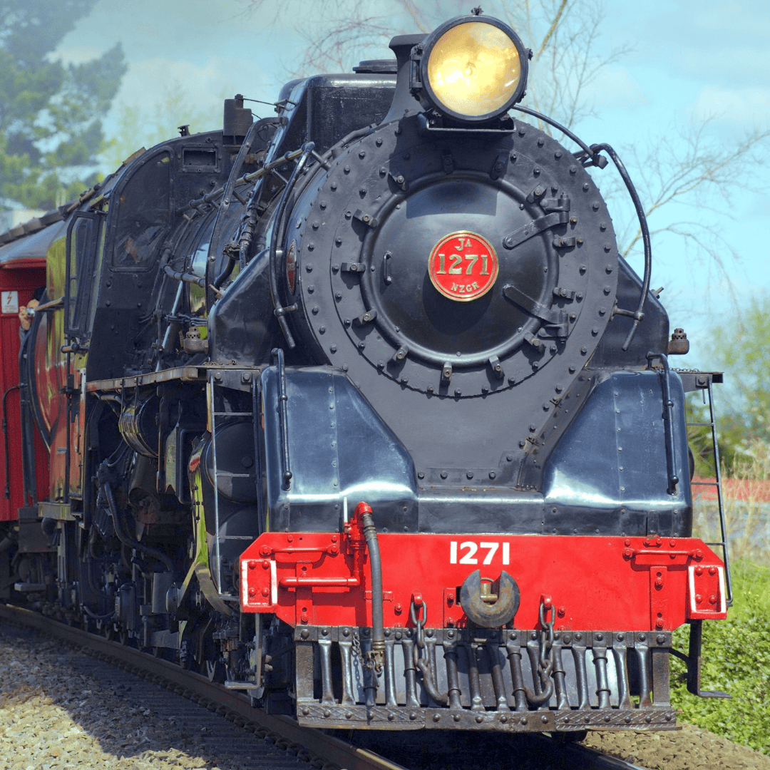 front of black and red locomotive